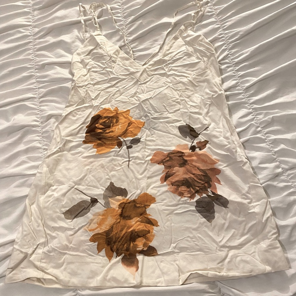 Vince Camuto swim dress. Size medium. Never worn. Criss cross back.